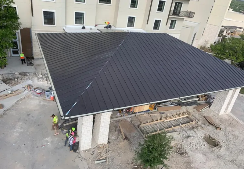 Metal roofing installation team working on a commercial building in Cordele